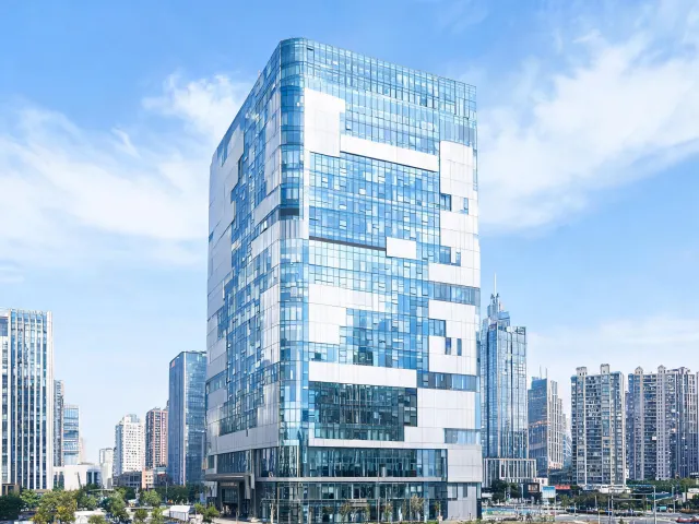 Corporate workplace tower with glass and panel facade